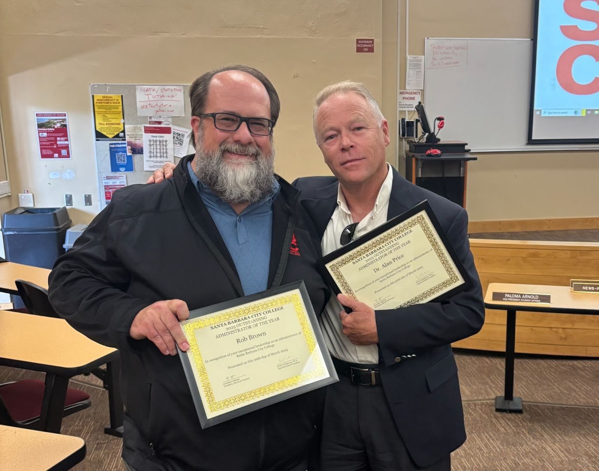 Rob Brown and Alan Price holding certificates.